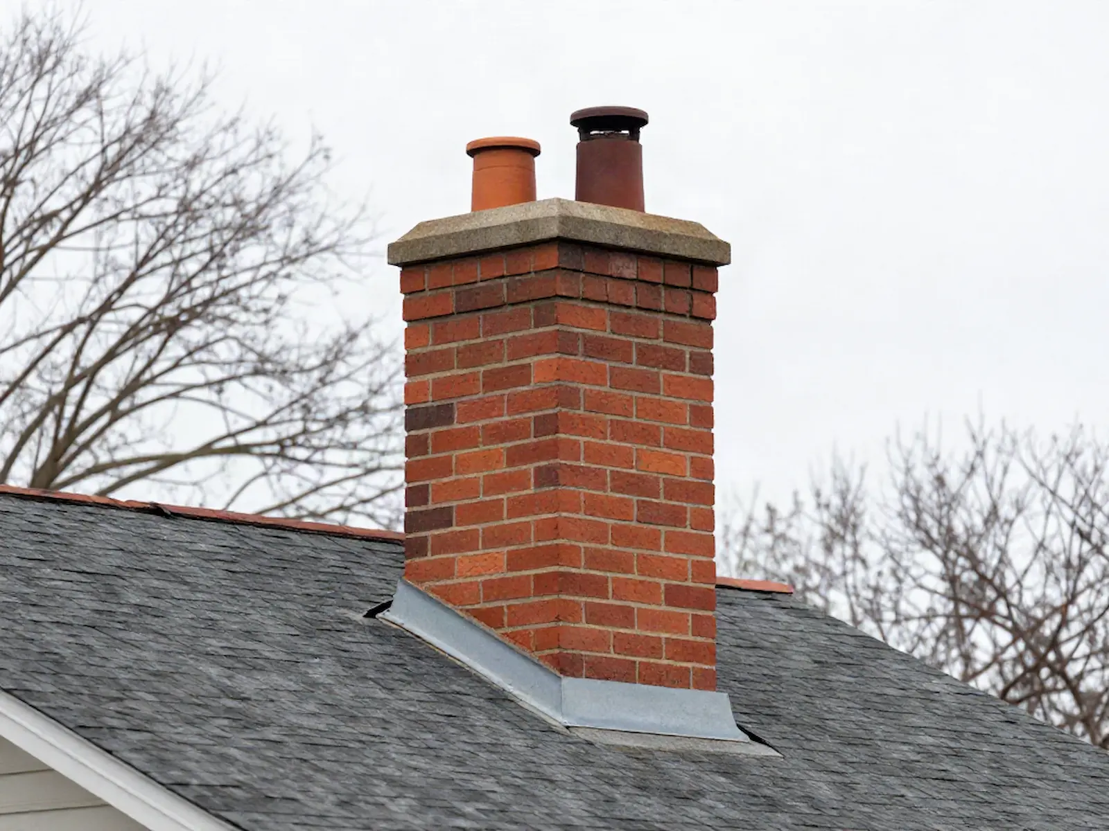 Brick chimney on a home served by Copper Bridge Chimney Services in Chicago, IL